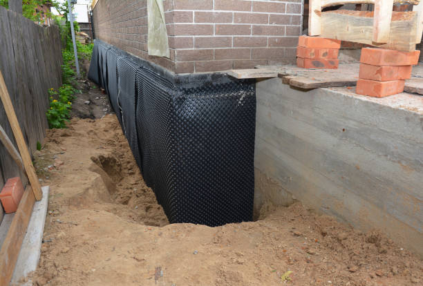 Happy homeowners after waterproofing job in Dimondale